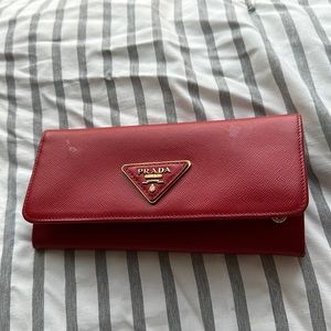 prada wallet surface with glue scratches